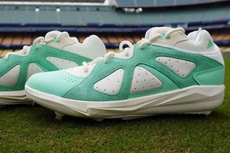 Bad Bunny x adidas BadBo 1.0 Cleat in Mint Green, featuring white leather upper with mint green toe box and suede overlays, debuted by Kiké Hernández