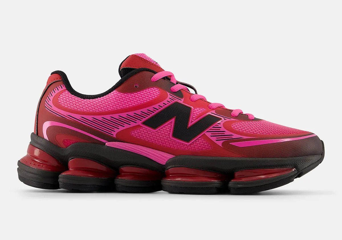 New Balance 2000 in Pink Heat colorway, showcasing the bulbous toe box and stacked midsole geometry with mesh and synthetic upper construction