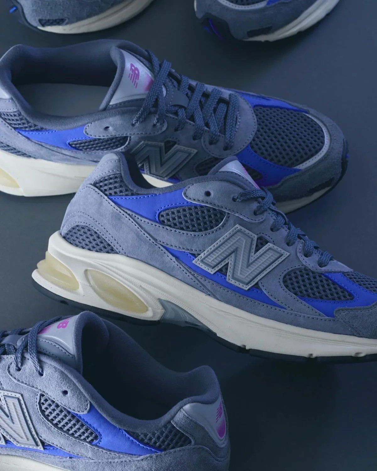 Liberaiders x UNIK x New Balance 2010 'Walk Together, Bonded by True Friendship' sneaker with grey mesh upper, blue underlays, and purple branding accents