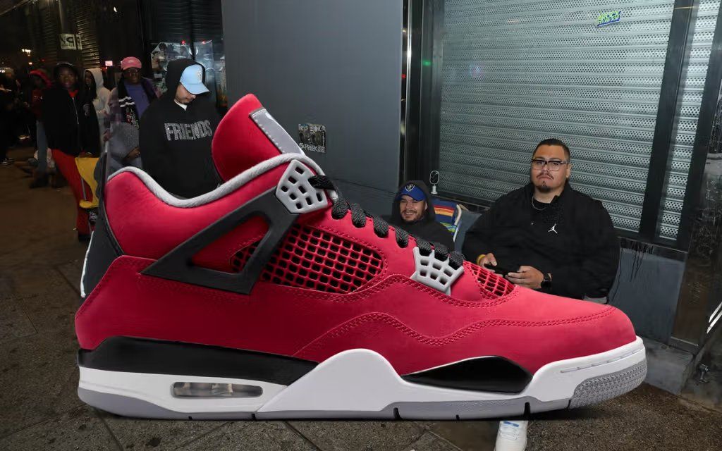 Air Jordan 4 'Toro Bravo' in full-profile view showcasing premium materials and color blocking