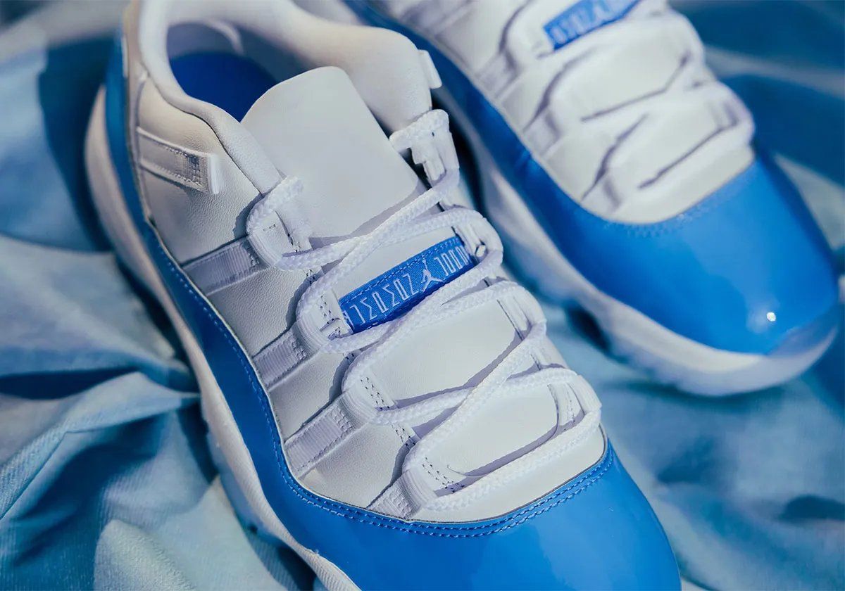 Air Jordan 11 Low UNC in white leather and University Blue patent mudguard, lateral view