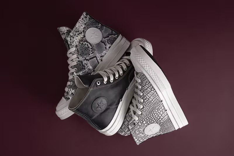 Converse First String Chuck Taylor high-top in premium black leather with refined textile finish