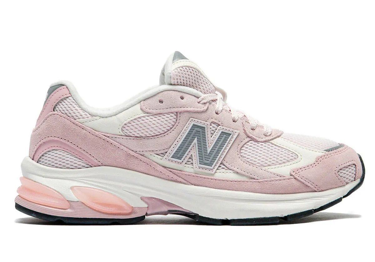 New Balance 2010 in Pink Chalk colorway, side profile view showcasing pastel tone and 99x-inspired design elements