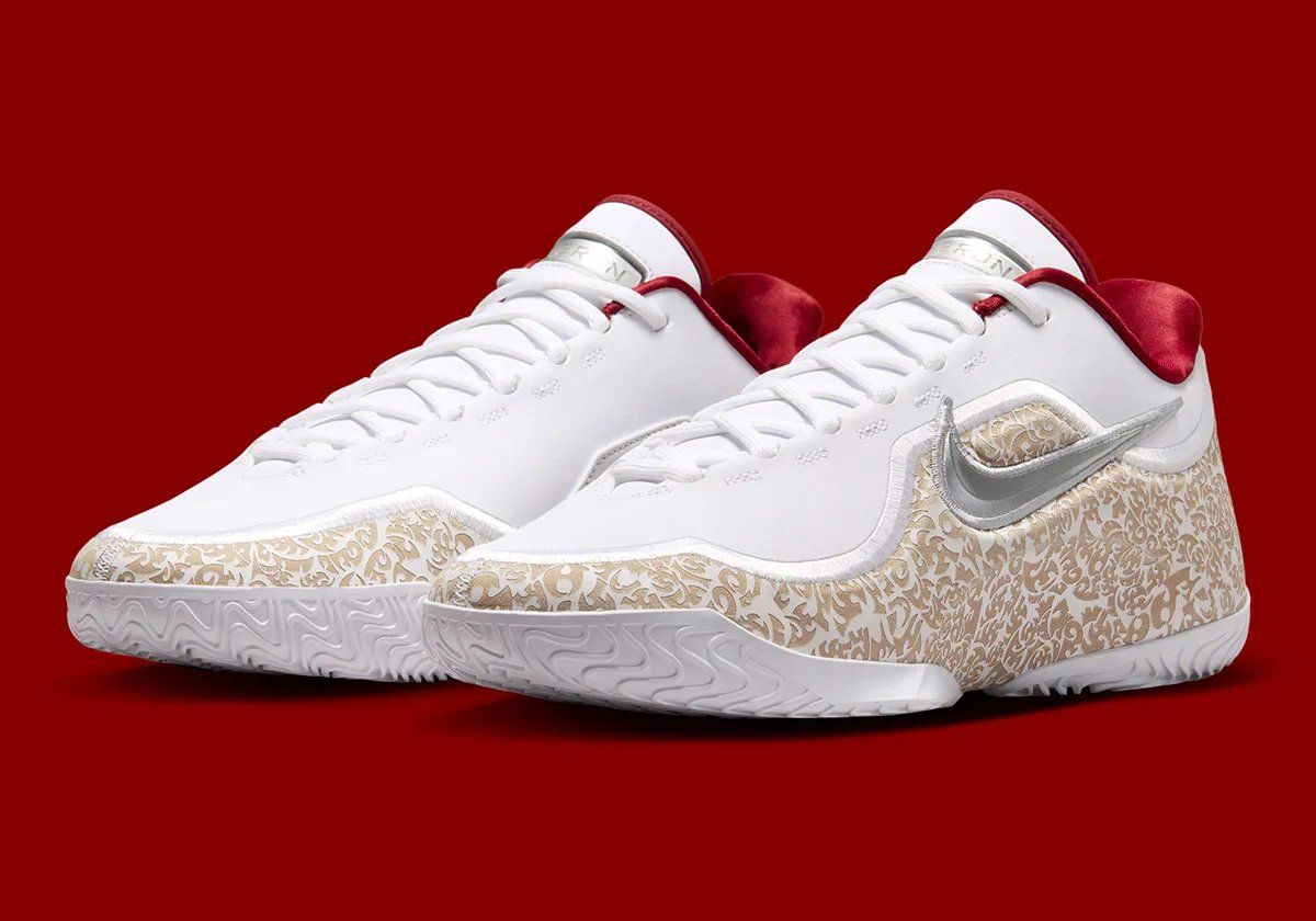 Nike LeBron 23 'Laser' colorway with white upper, laser-etched crown shell, and red satin interior lining