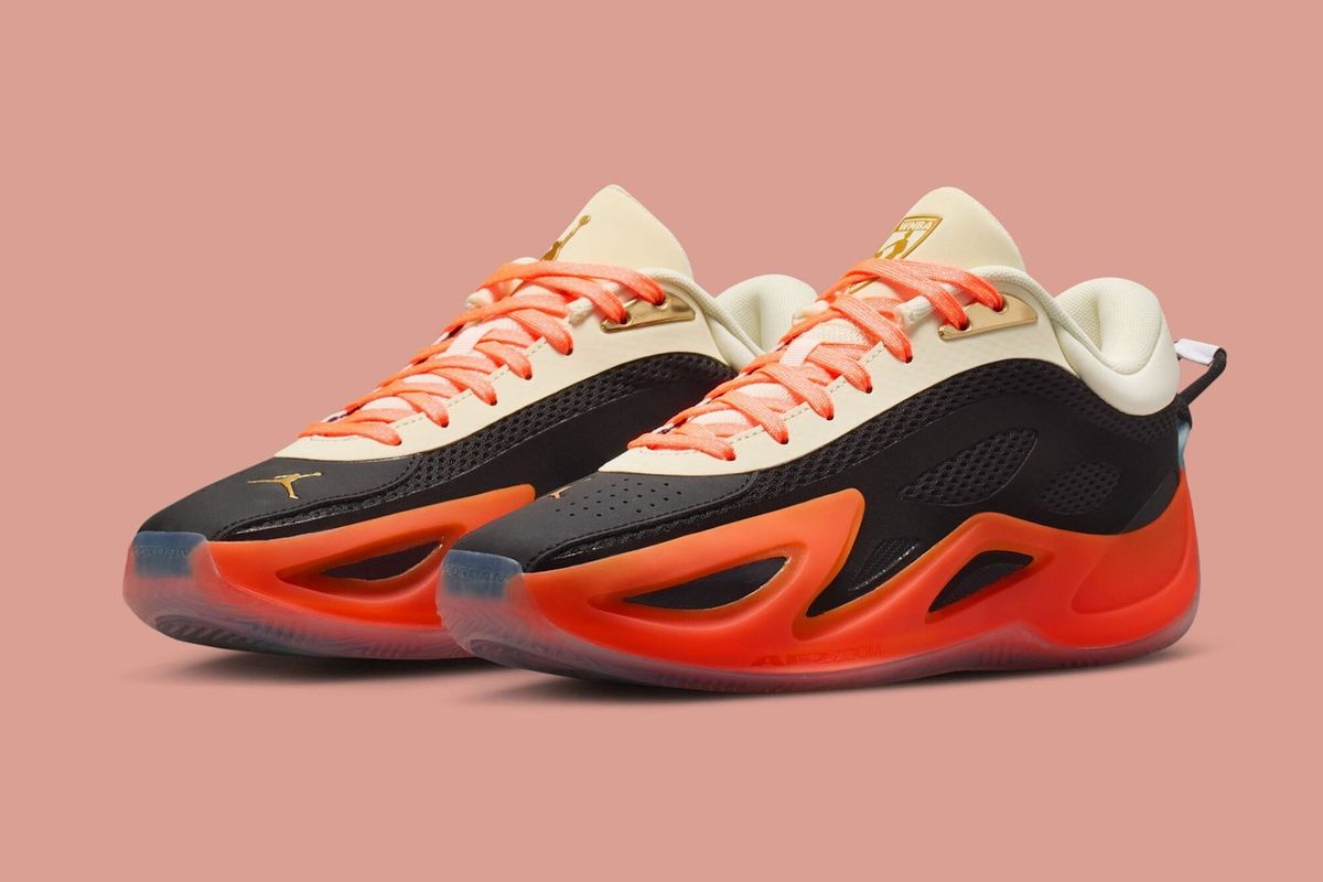 Jordan Heir 2.0 in Birds of Paradise colorway featuring black, metallic gold, total orange, and coconut milk.