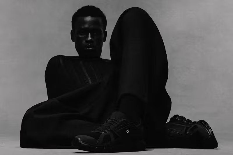 On x Dover Street Market Cloud 6 in all-black with reflective accents and repositioned metal eyelet