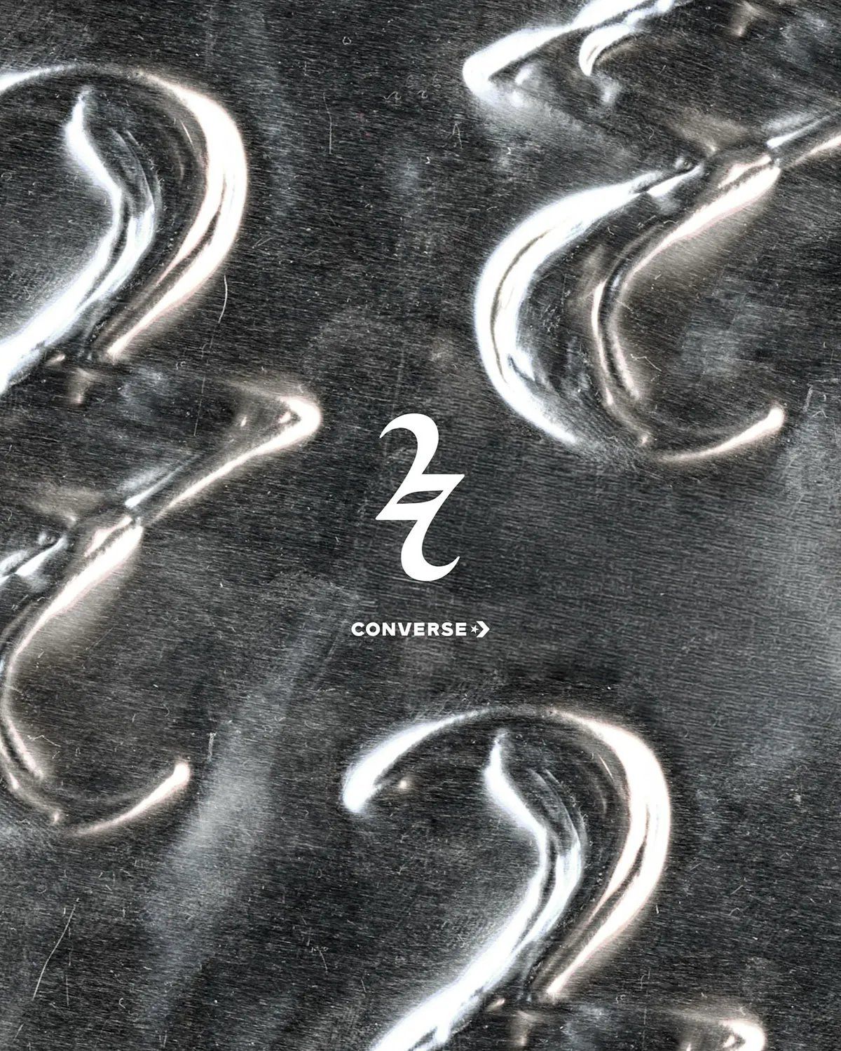 Converse Shai 002 teaser image featuring SGA gothic logo on stainless steel backdrop