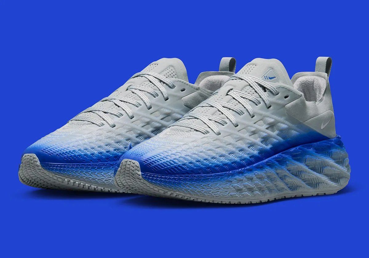 Nike Ava Edge in grey and blue gradient colorway, showcasing pixelated sole design and refined upper construction