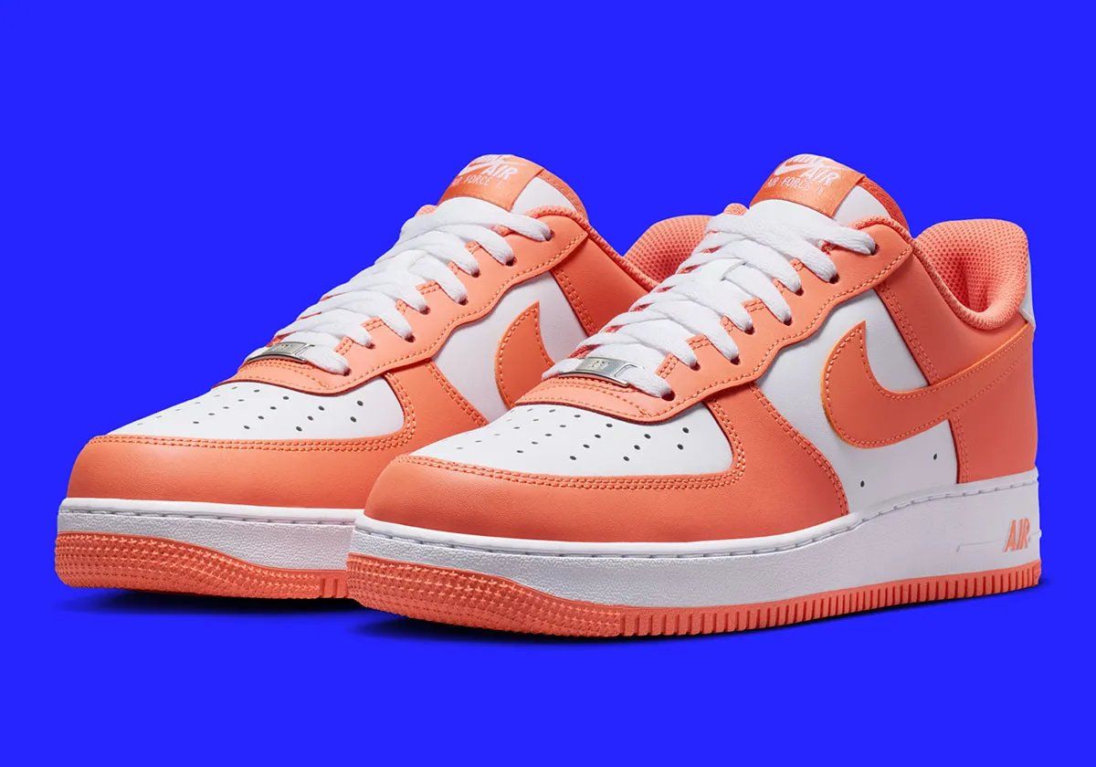 Nike Air Force 1 Low in Orange Frost colorway showing full lateral and medial views
