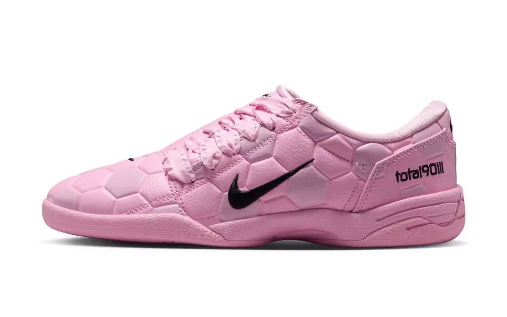 Nike Total 90 III in soft pink colorway, showing the iconic three-stripe football boot silhouette
