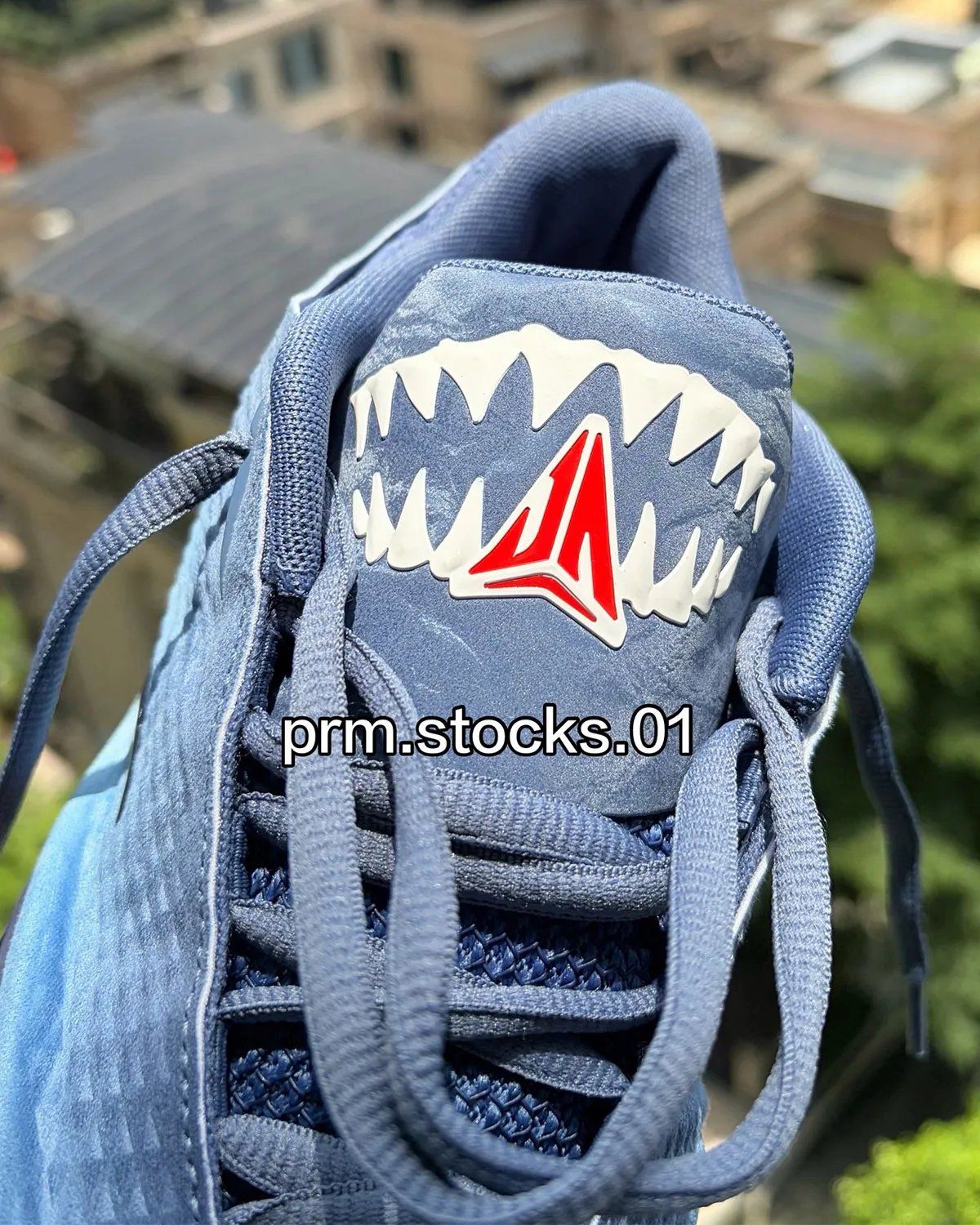 Nike Ja 4 "Jaws" in Diffused Blue, Blackened Blue, and University Red with shark teeth tongue detailing, inspired by classic film poster design