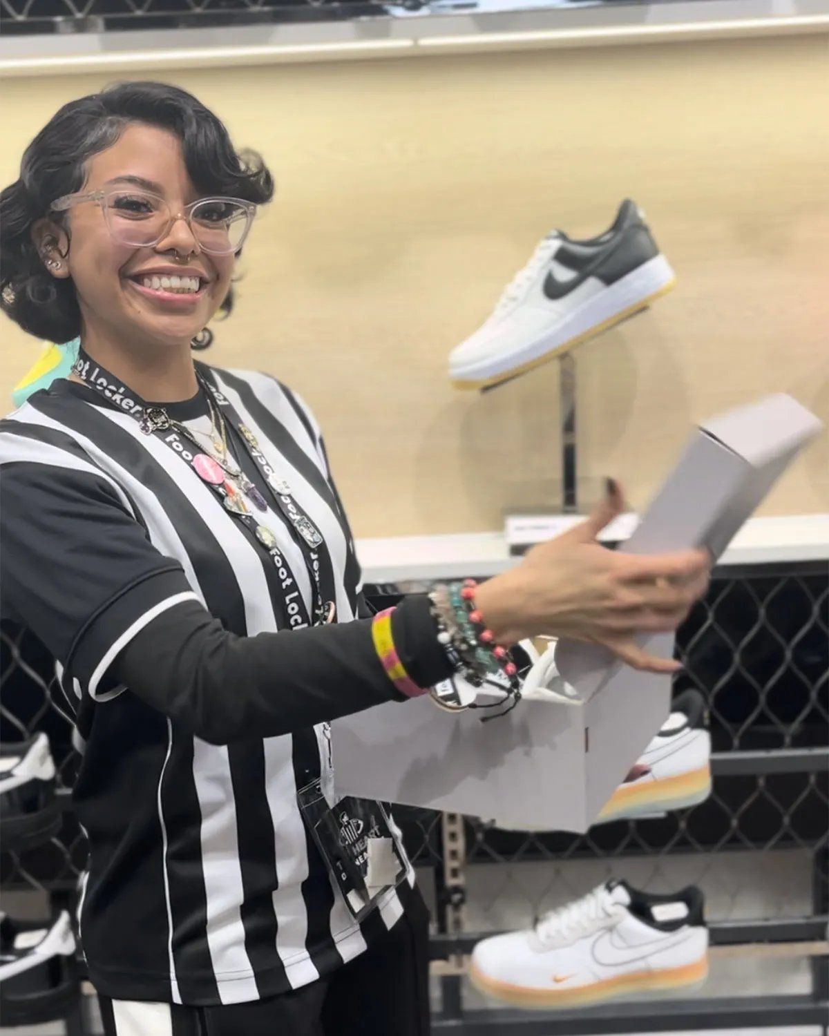 Nike Air Force 1 Low in Triple White colorway, part of Foot Locker's employee giveaway campaign