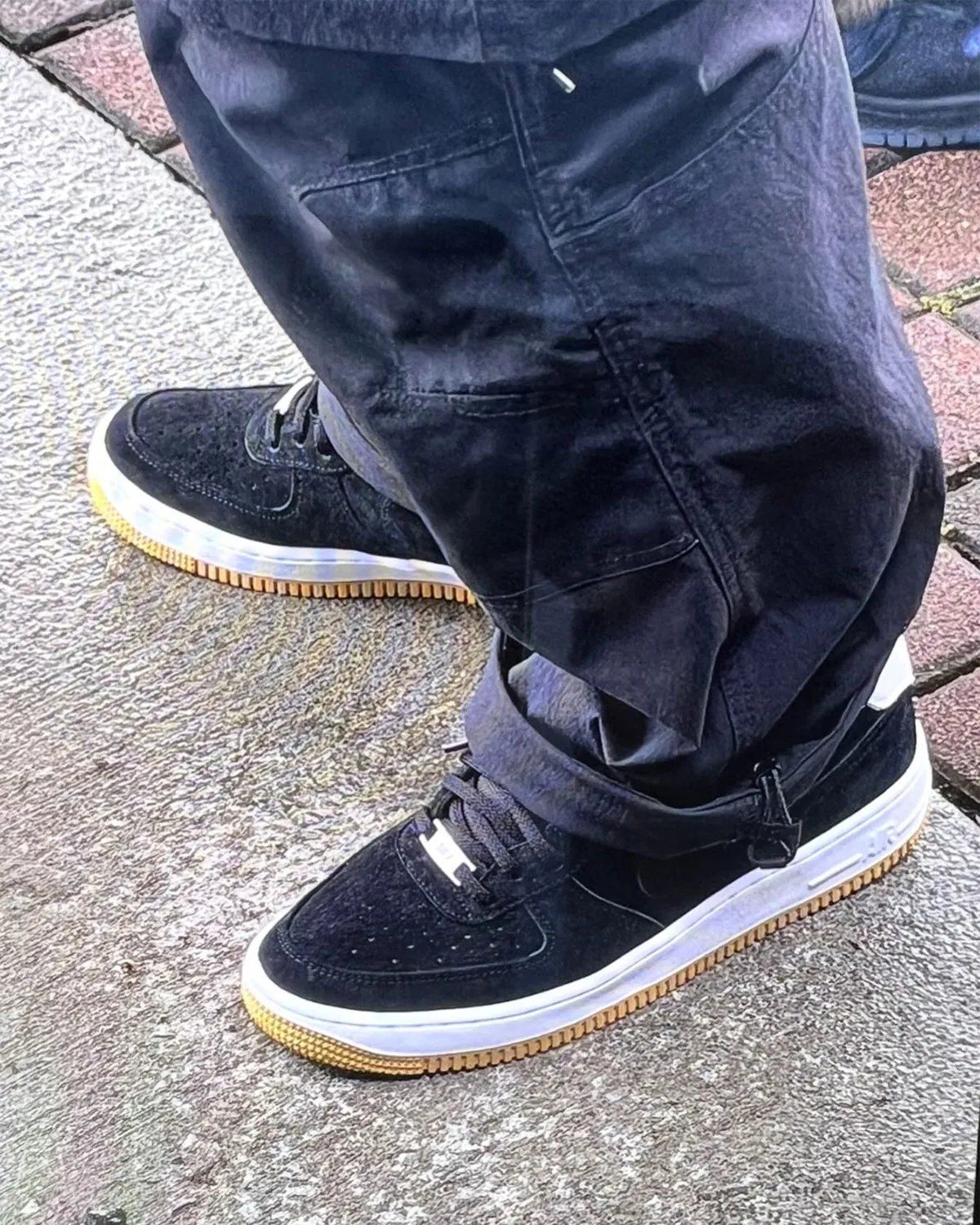 Nike SB Air Force 1 Low in Black nubuck with white midsole and gum rubber outsole, featuring white leather backtab