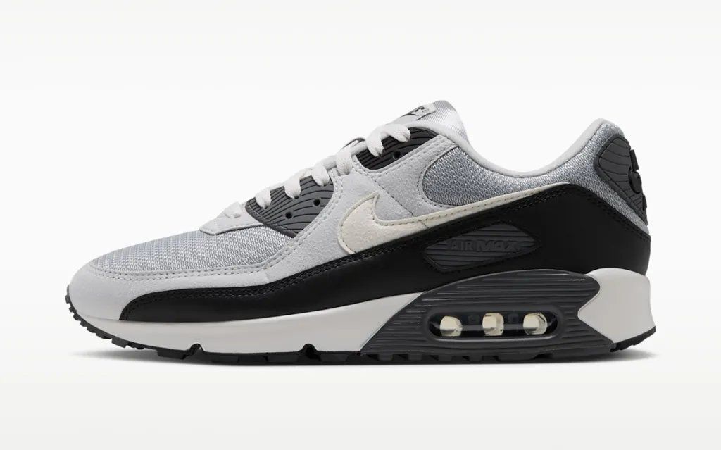 Nike Air Max 90 in Iron Grey with OG-inspired color-blocking across the upper and segmented Air Max heel unit