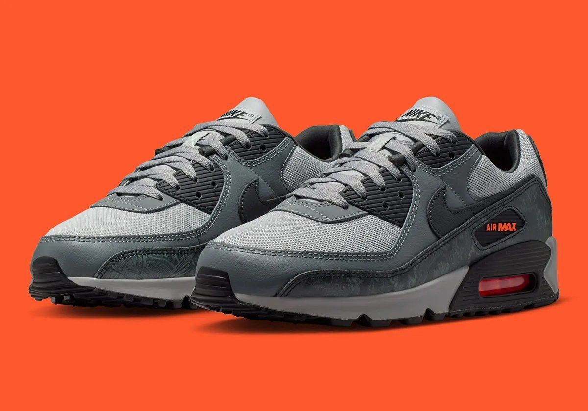 Nike Air Max 90 in greyscale with printed mudguard and Hyper Crimson accents