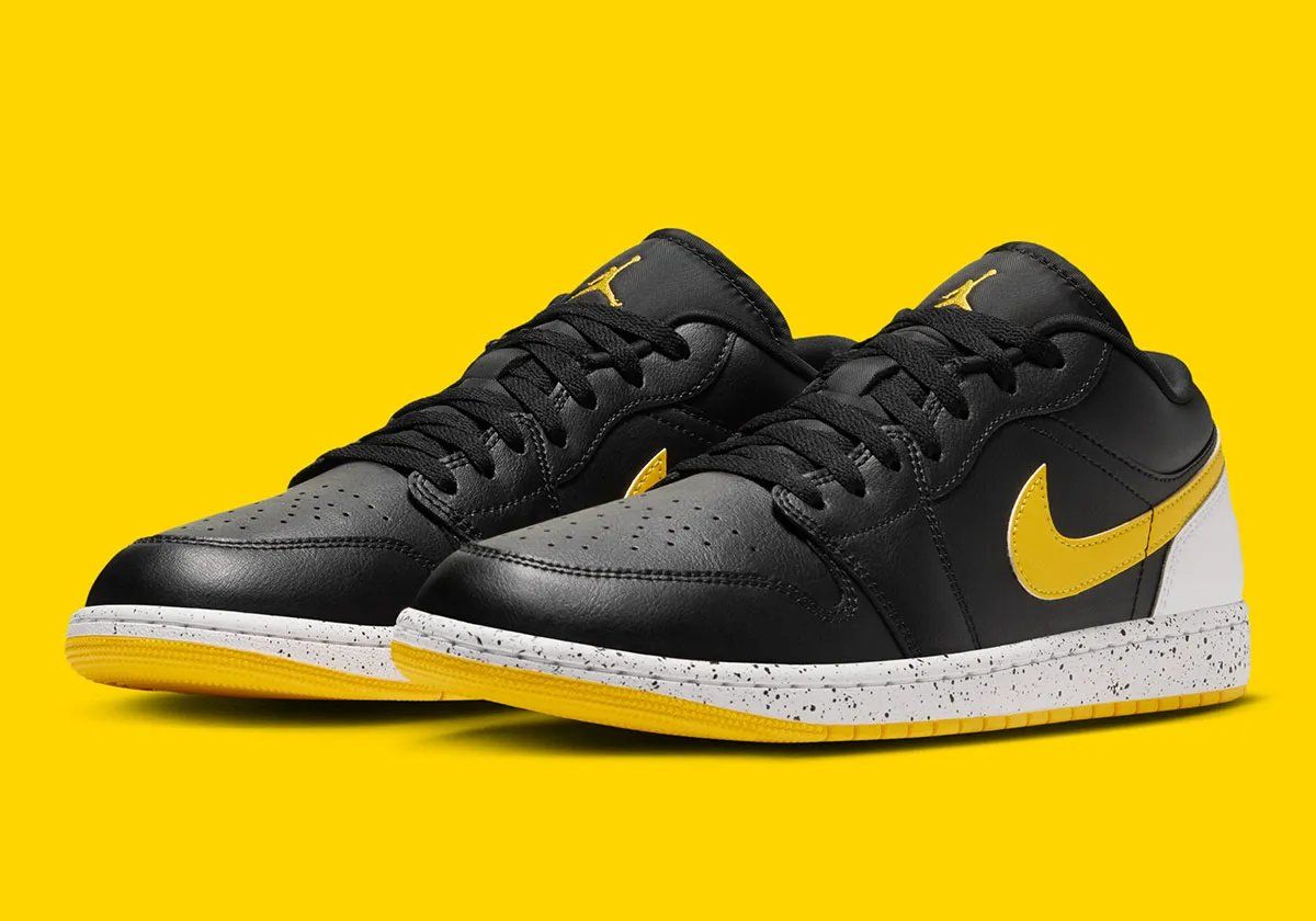 Air Jordan 1 Low in Tour Yellow with black leather upper, Tour Yellow Swoosh, and speckled white midsole