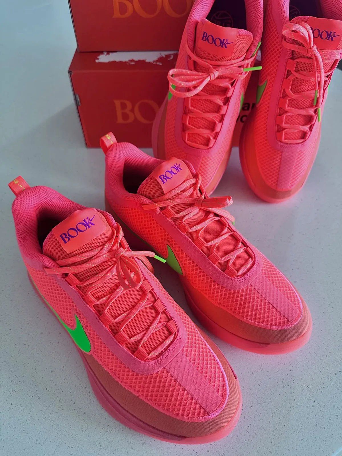 Nike Book 2 EYBL PE in pink and green colorway with chain-link mesh upper and purple accents