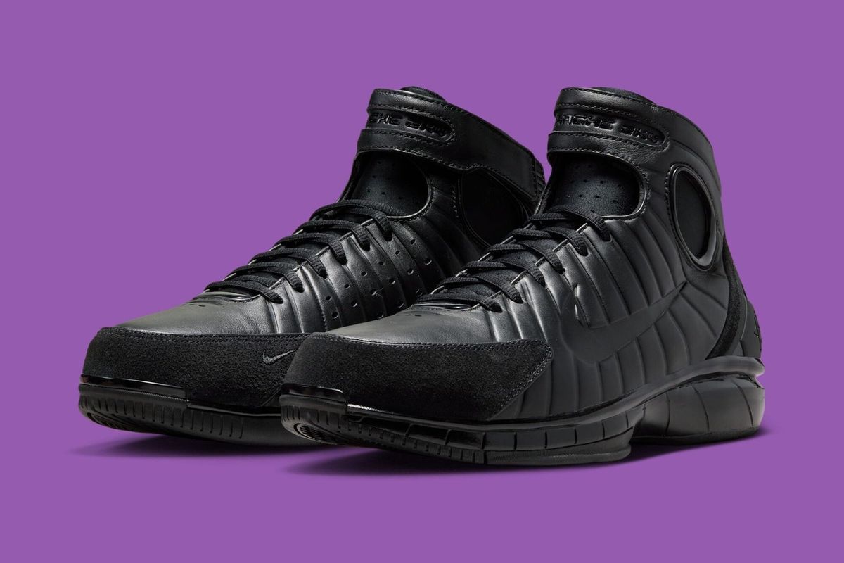 Nike Air Zoom Huarache 2K4 OT in all-black colorway, showing the full profile silhouette with Huarache-inspired fit system and Zoom cushioning unit