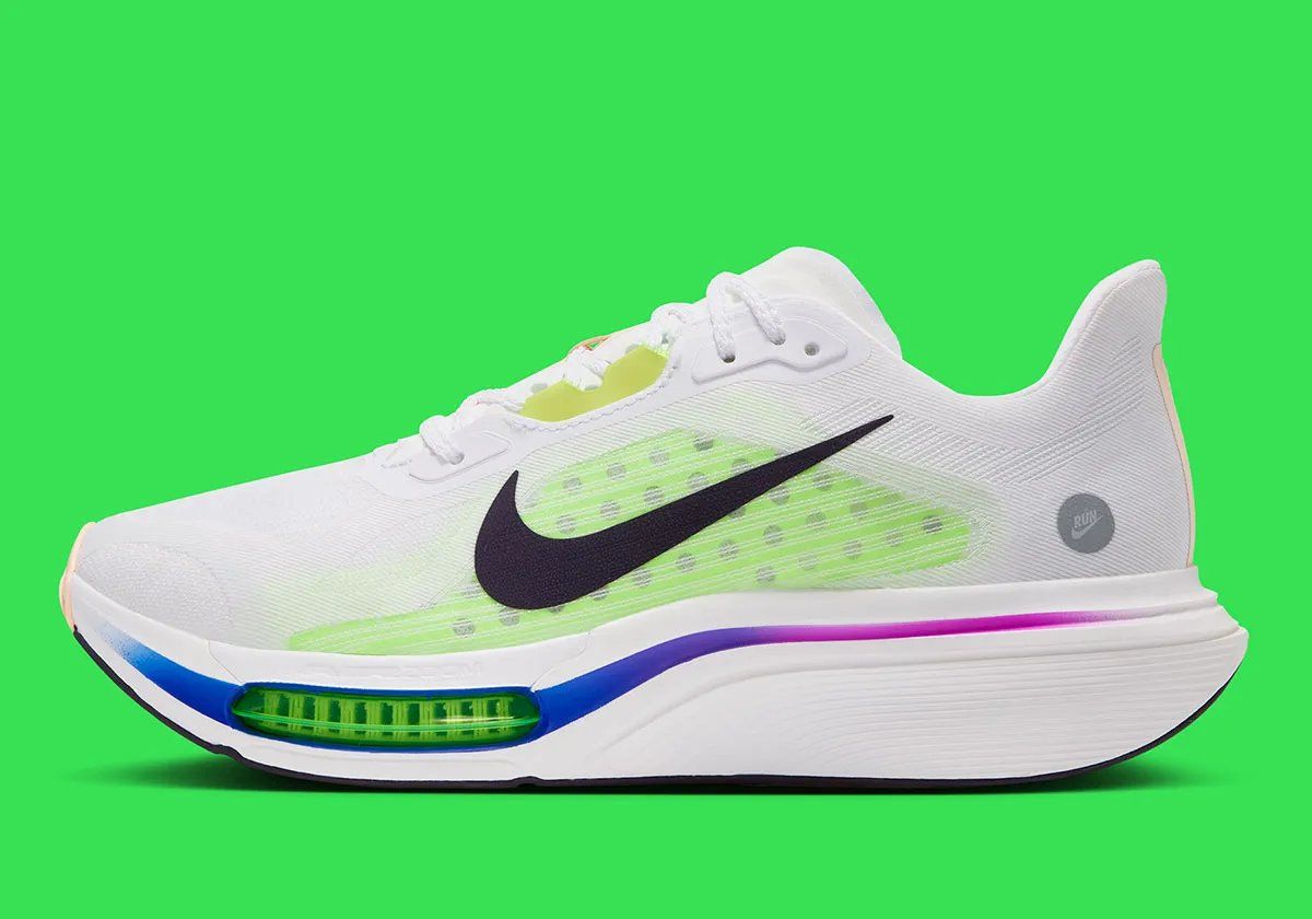 Nike Pegasus Plus 2 in White/Volt colorway featuring visible forefoot Zoom Air and Volt accents