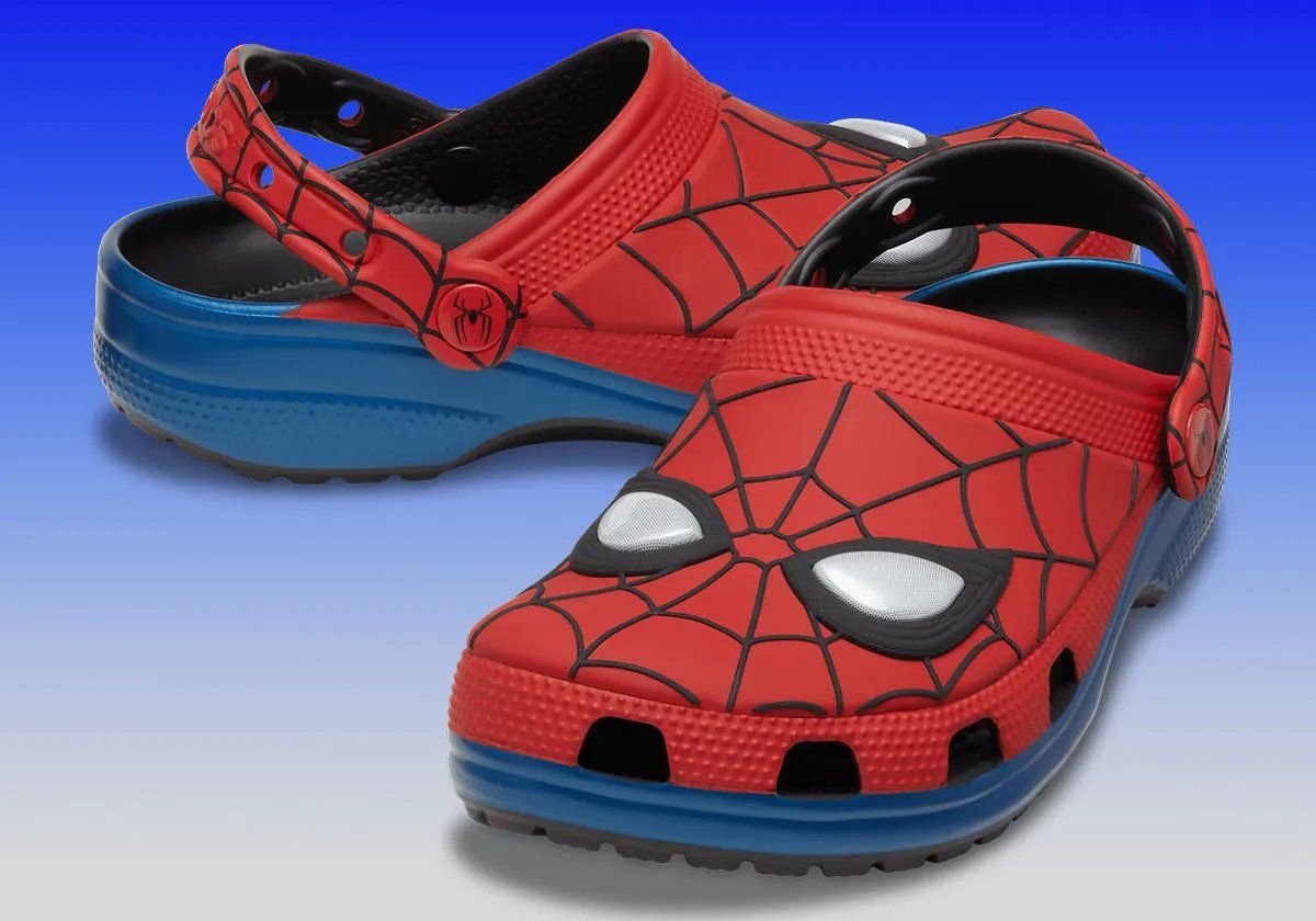 Crocs Classic Clog in red and blue Spider-Man Peter Parker colorway with web patterning and embroidered character eyes