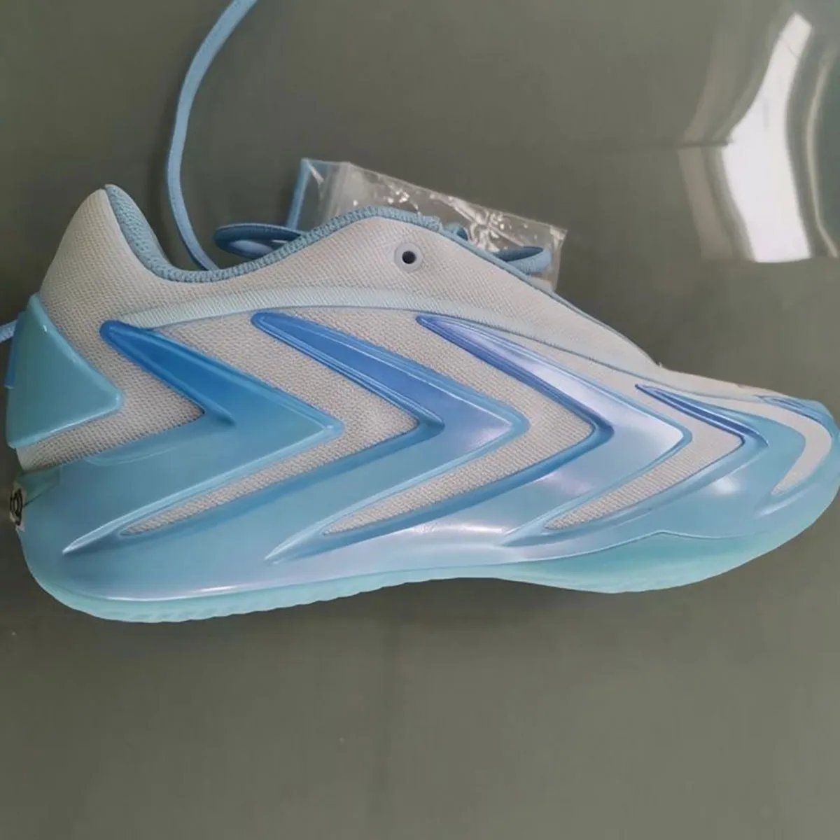 adidas Anthony Edwards 3 in Sky Tint colorway featuring white mesh base with gradient sky blue cage detailing