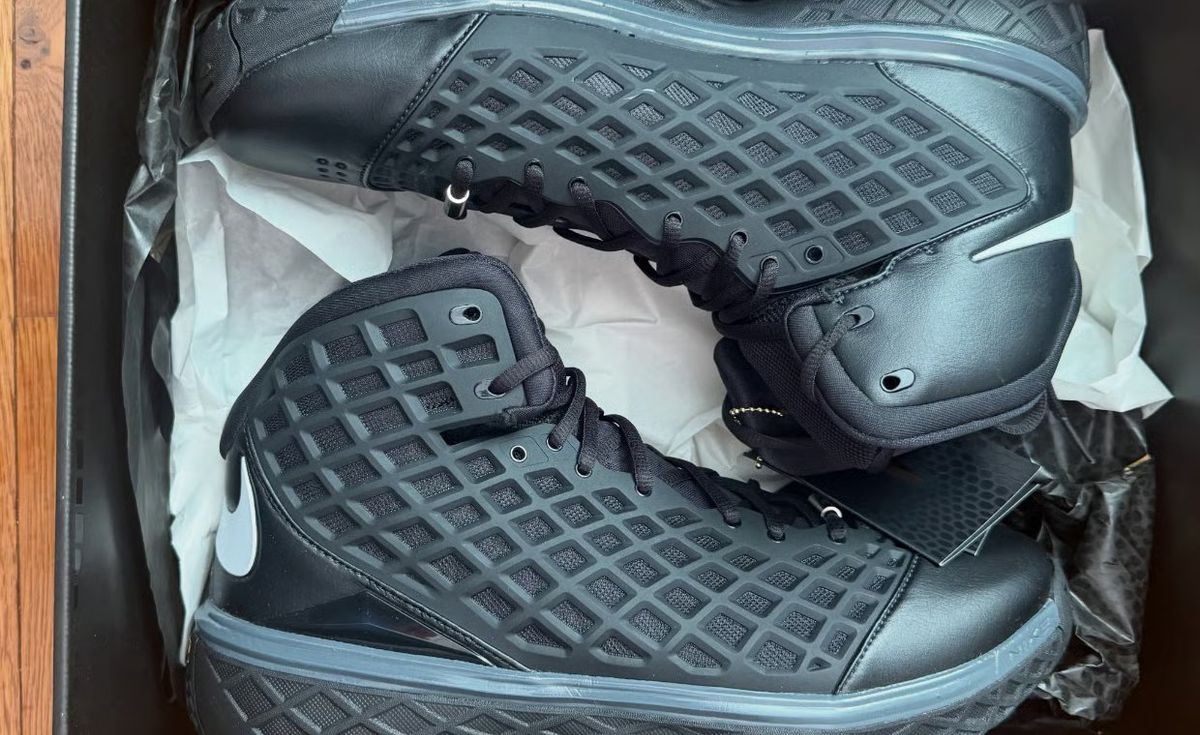 Nike Kobe 3 Protro Orca in black leather with white Swoosh branding and mesh side panels