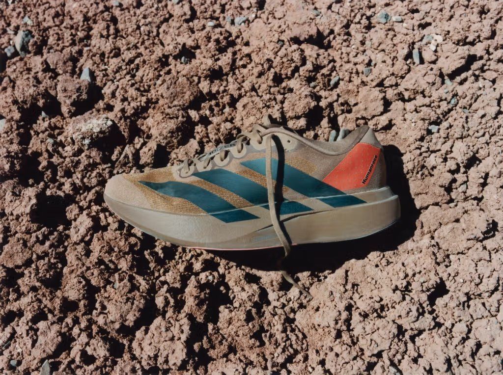 Adidas Evo SL x Pharrell running shoe in Mars dust-inspired colorway with muted earth tones and metallic accents