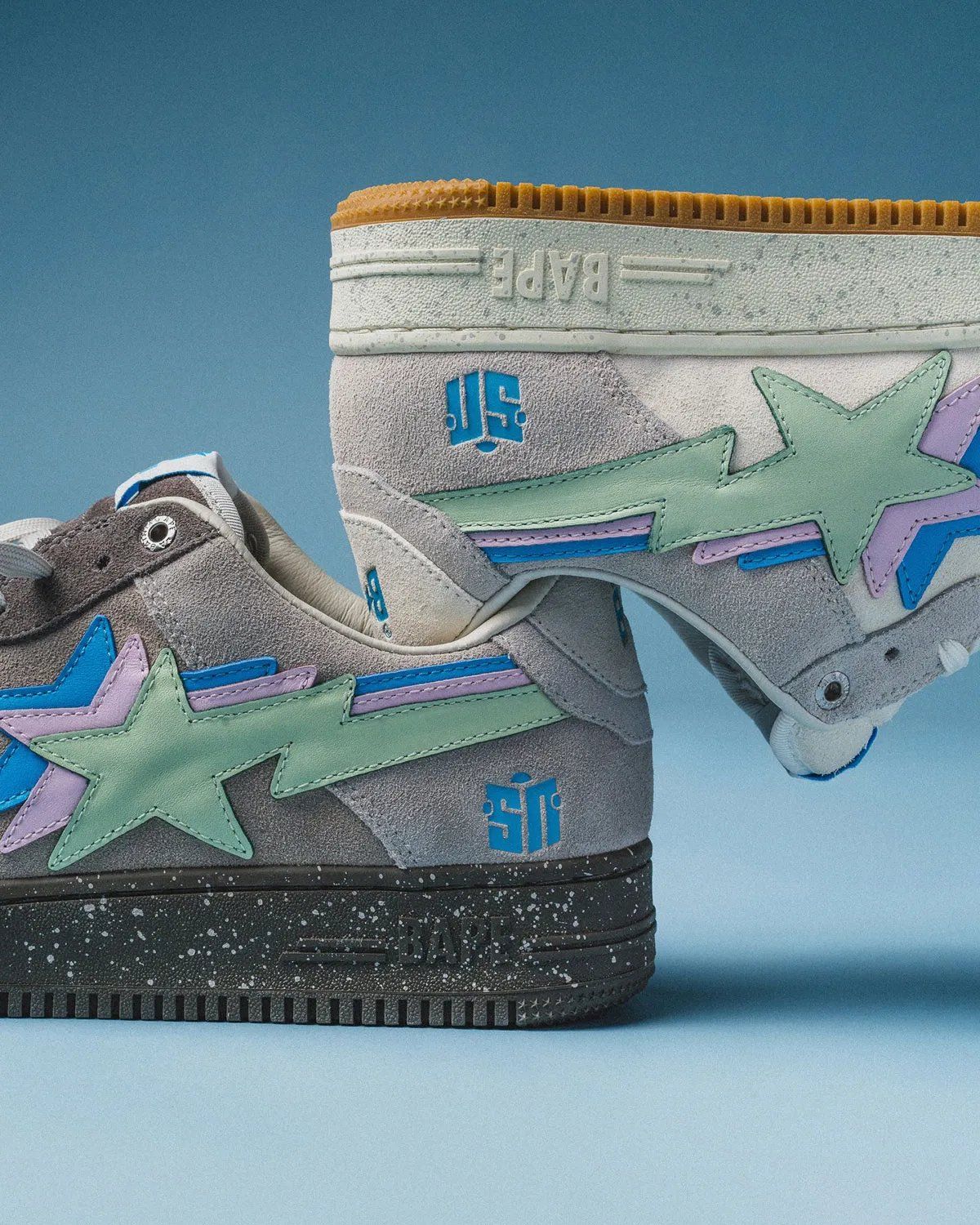 Sneaker News x A Bathing Ape Bape Sta collaboration in white Day and grey Night colorways featuring triple-stacked logos