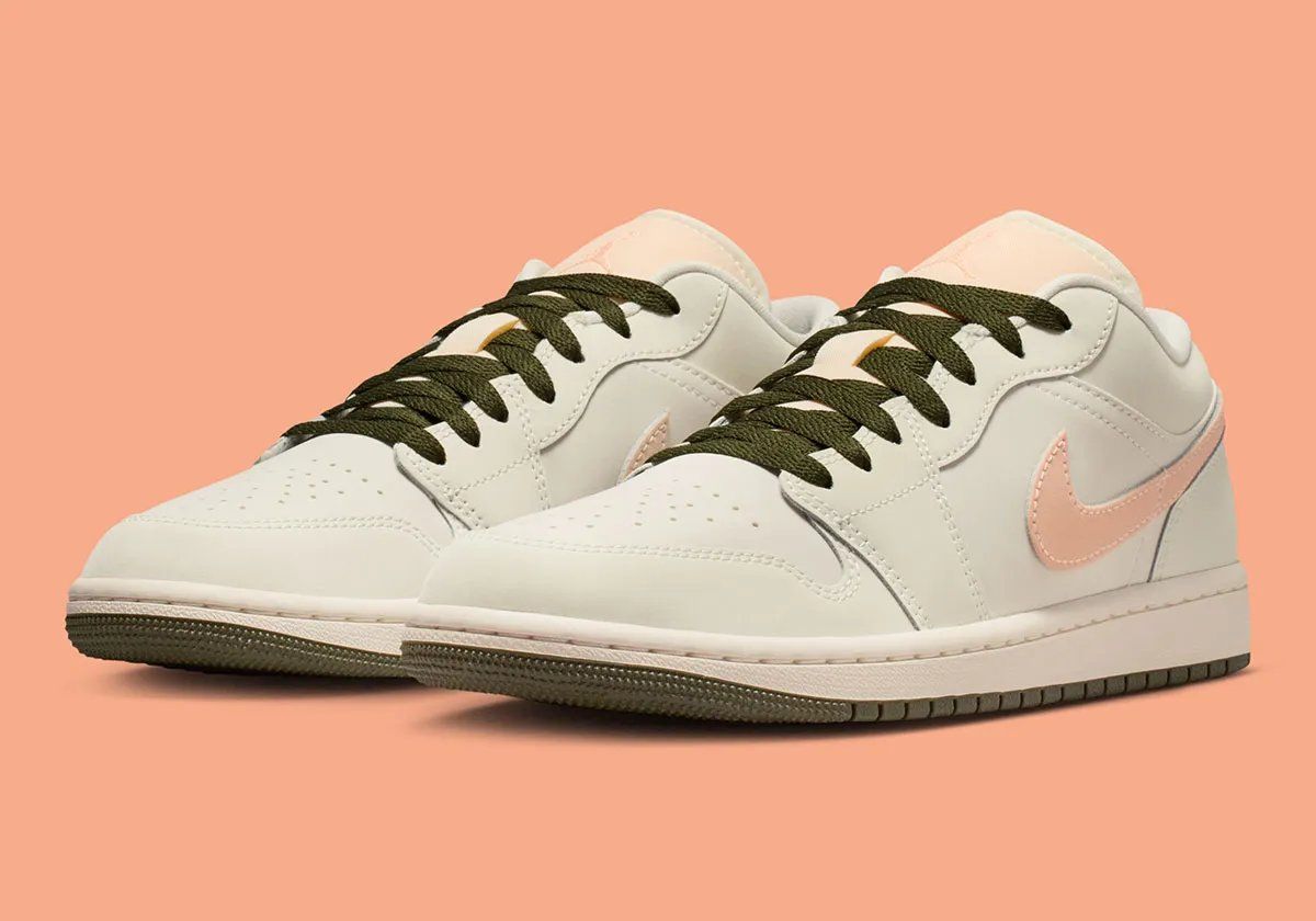Nike Air Jordan 1 Low in Crimson Tint colorway, showing leather construction and ankle collar detail