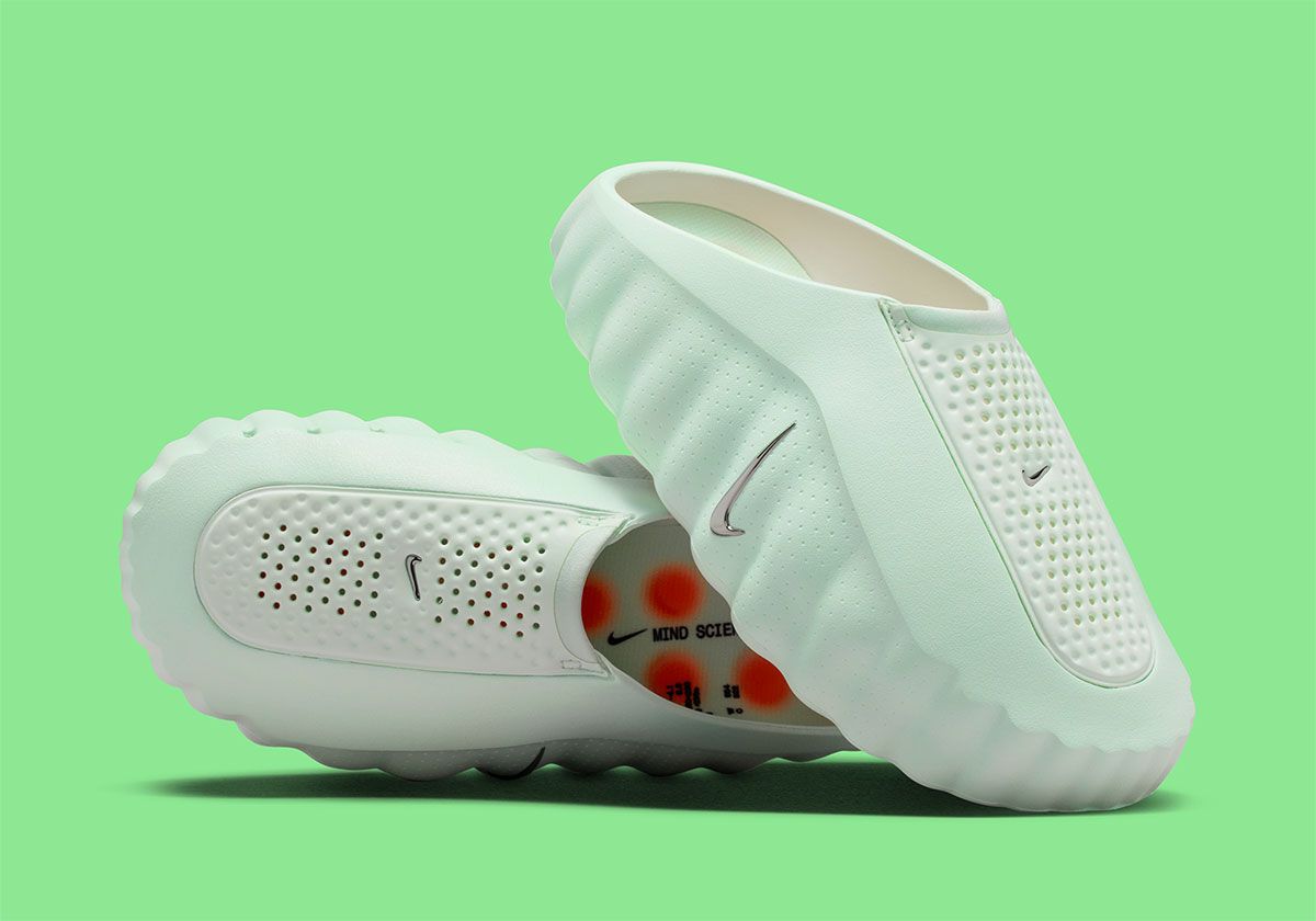 Nike Mind 001 Barely Green women's slide showing soft viridian upper and contrasting pod sole system