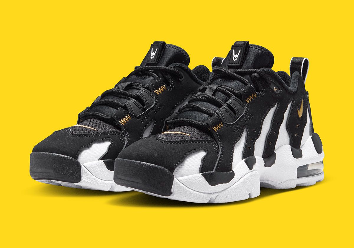 Nike Air DT Max '96 Low in white, black, and gold colorway, showing mesh side cutouts and shortened collar design