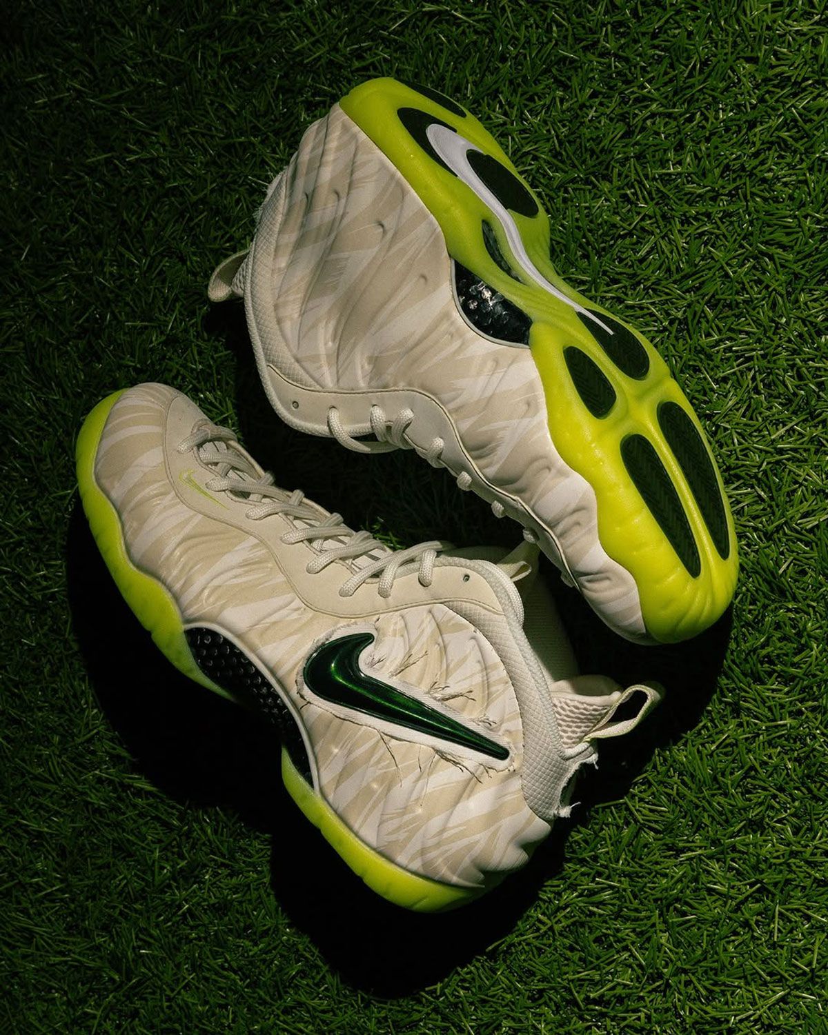 Oregon Ducks x Nike Air Foamposite Pro Mummy Duck in Phantom colorway, showing mummy-wrapped upper texture and glow-in-the-dark volt outsole