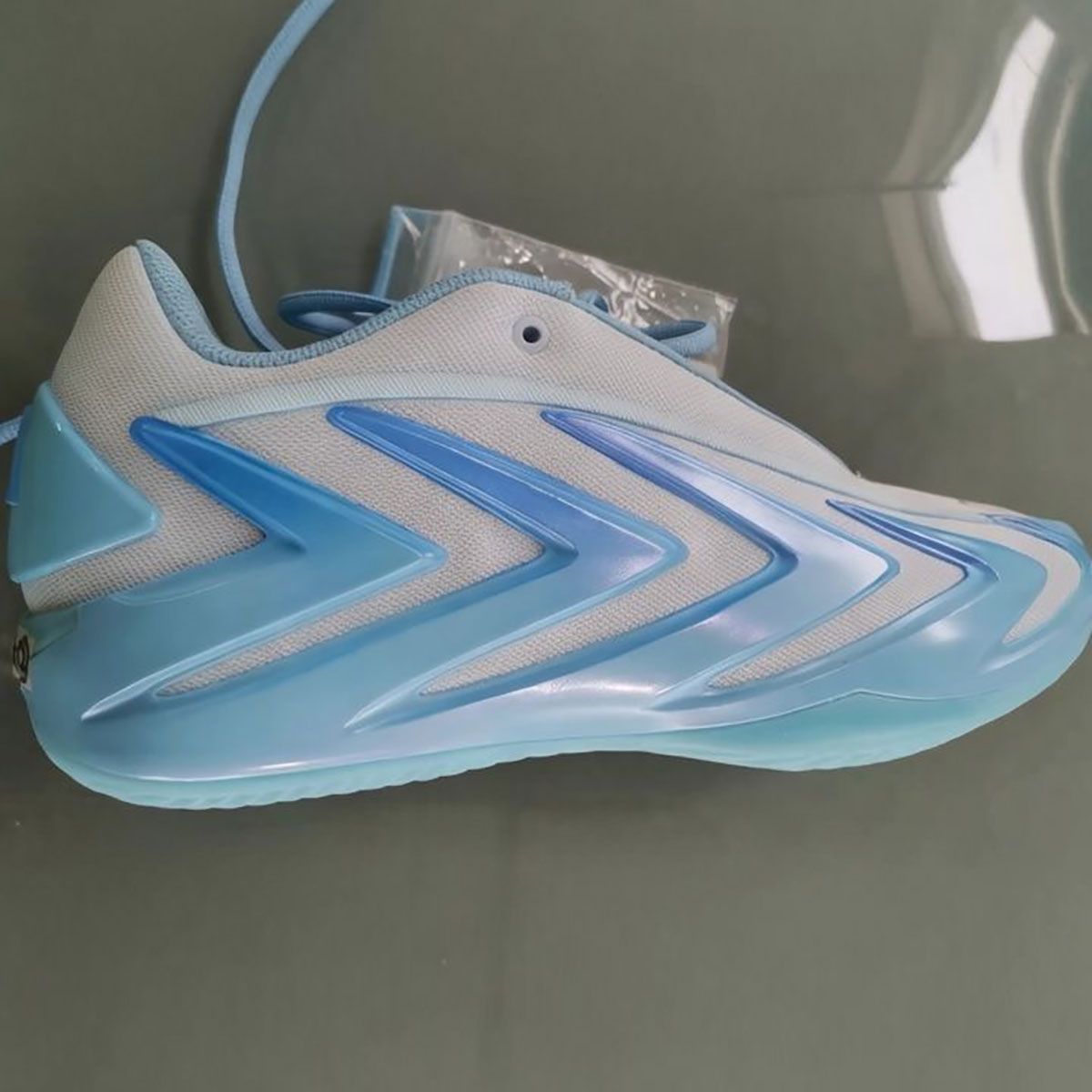adidas Anthony Edwards 3 in Sky Tint colorway featuring white mesh base with gradient sky blue cage detailing
