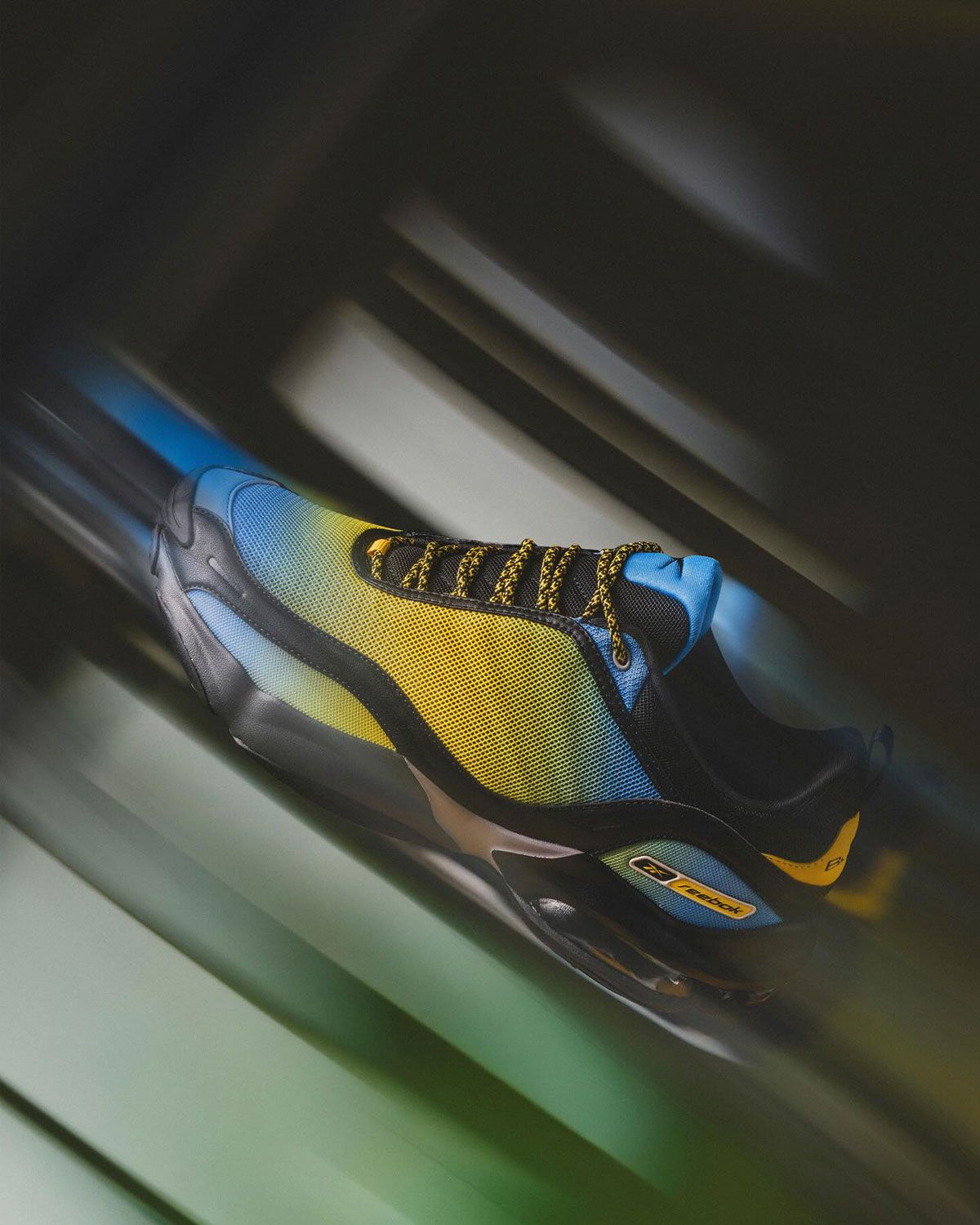Brain Child x Reebok DMX Series 3000 Blue Nebula colorway featuring baby-blue-to-yellow gradient mesh upper with black trim