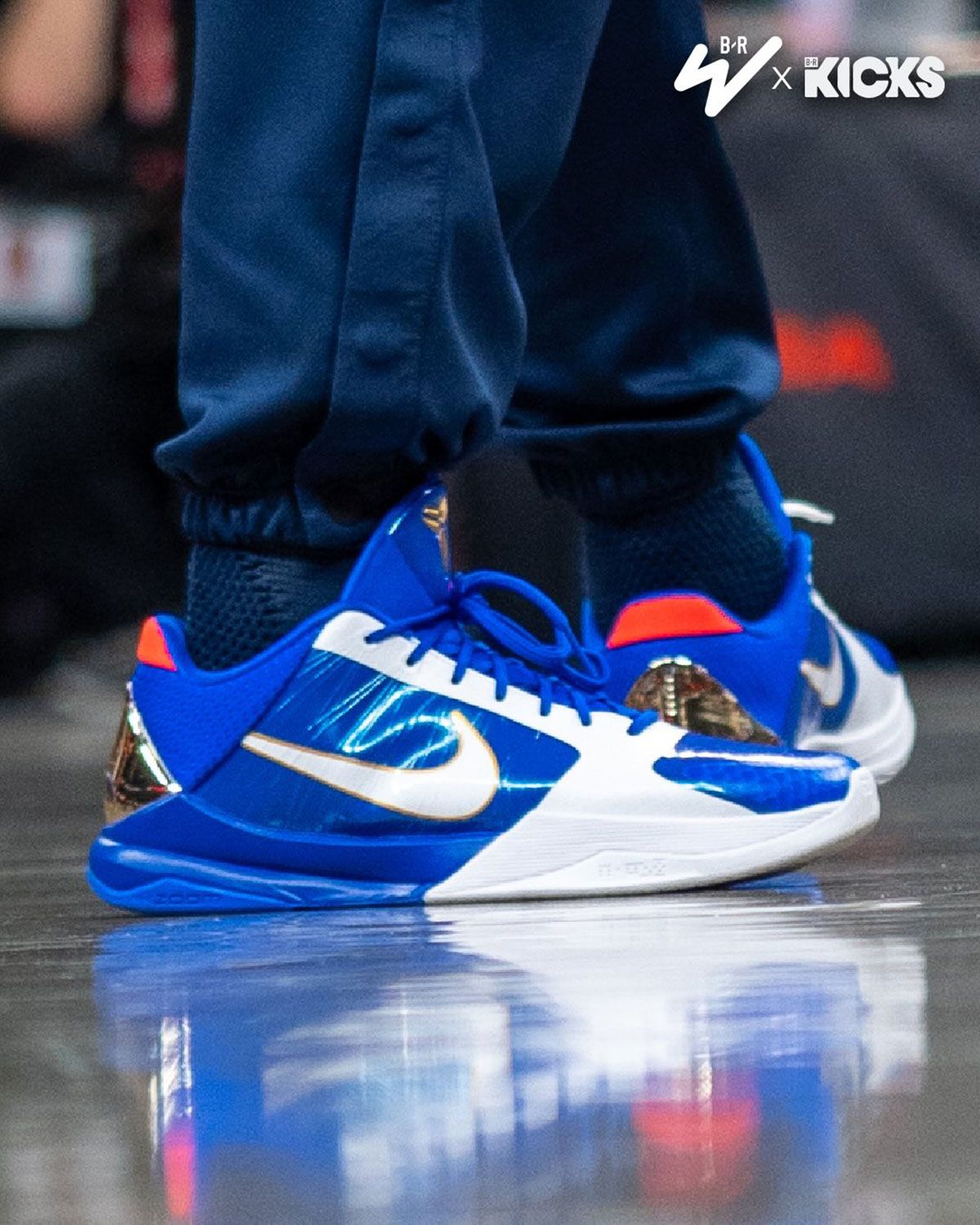 Caitlin Clark wearing a royal blue and gold Nike Kobe 5 Protro inspired by Sonic the Hedgehog, showcasing character-accurate design details on court