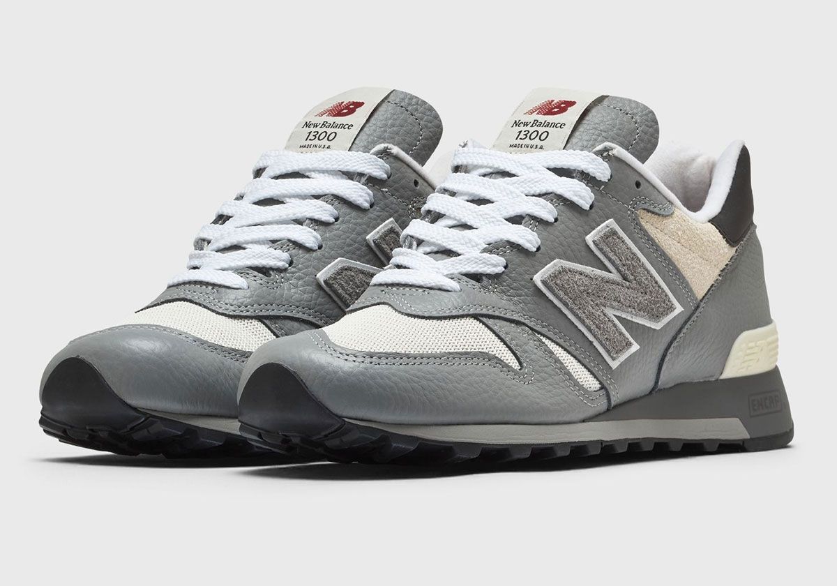 New Balance 1300 Slate Grey with pebbled leather upper, off-white mesh toe box, and hairy suede collar detail