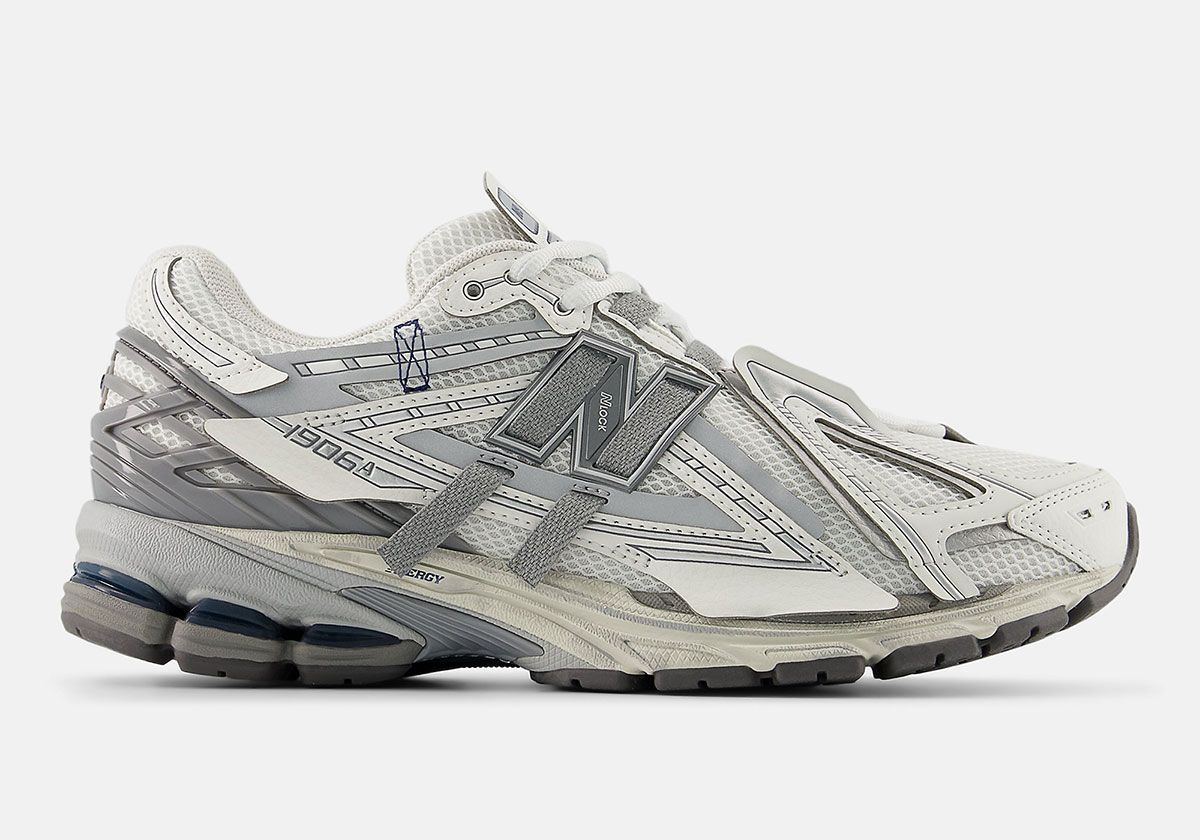 New Balance 1906A in Reflection/Shadow Grey colorway featuring white mesh upper with grey heel counter and distressed midsole detail