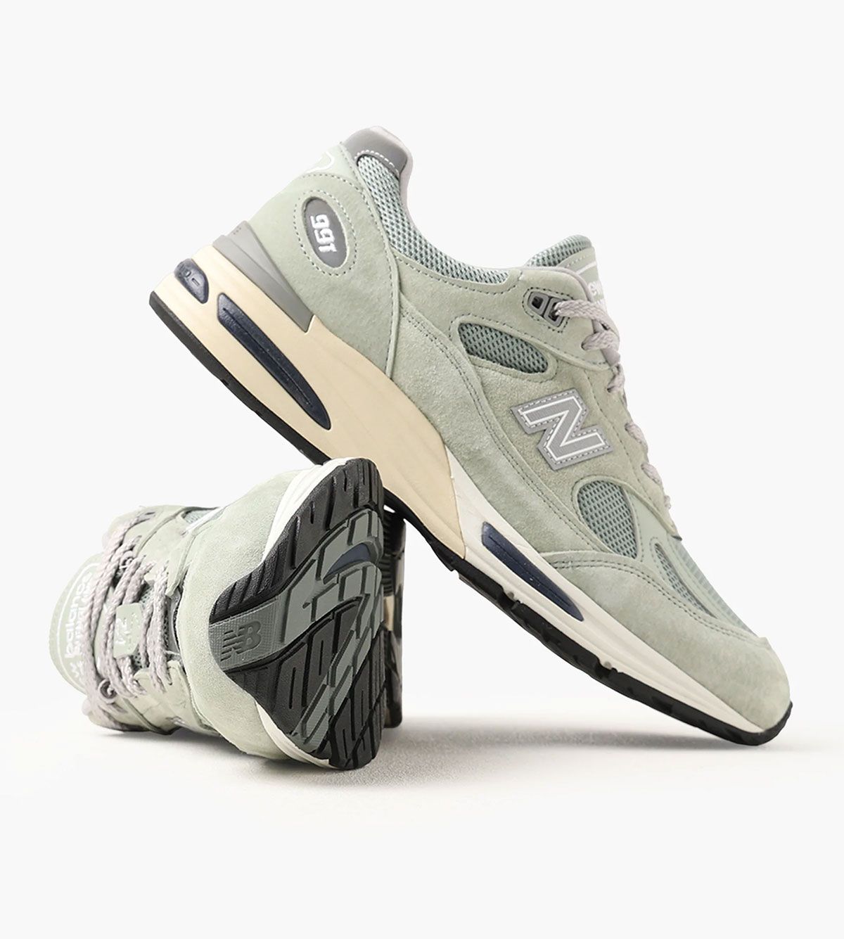 New Balance 991v2 Sea Glass colorway featuring soft green suede overlays with grey mesh and collar detailing