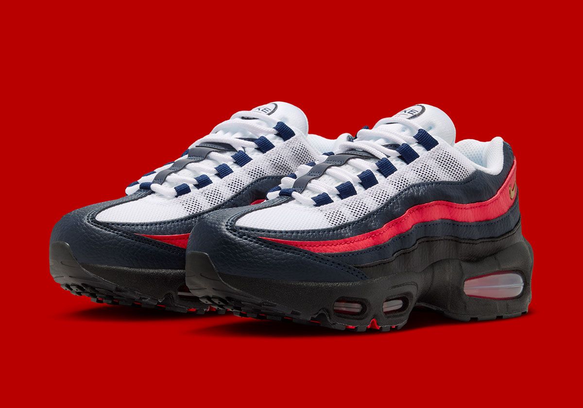 Nike Air Max 95 'FC' in Obsidian and Challenge Red, showing textured leather sidewalls and visible Air unit