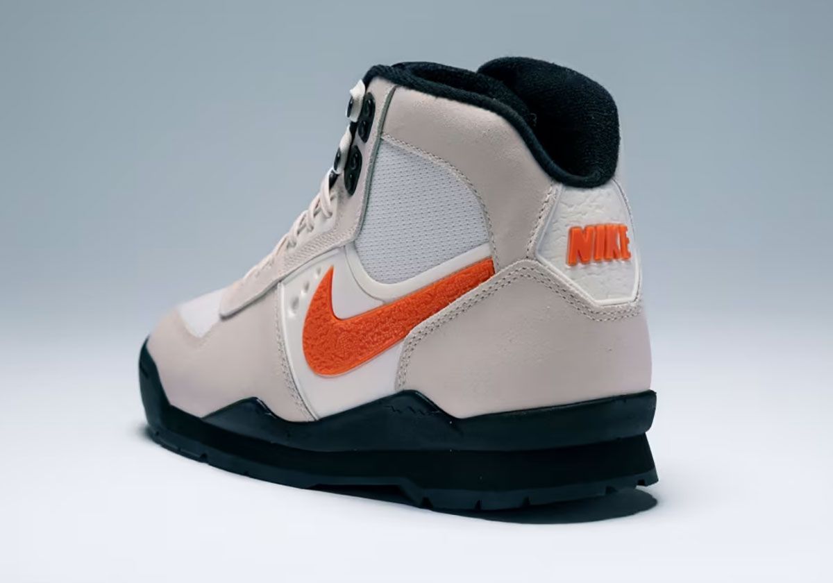 Nike Baltoro in Chalk with Safety Orange Swoosh and branding, side profile view