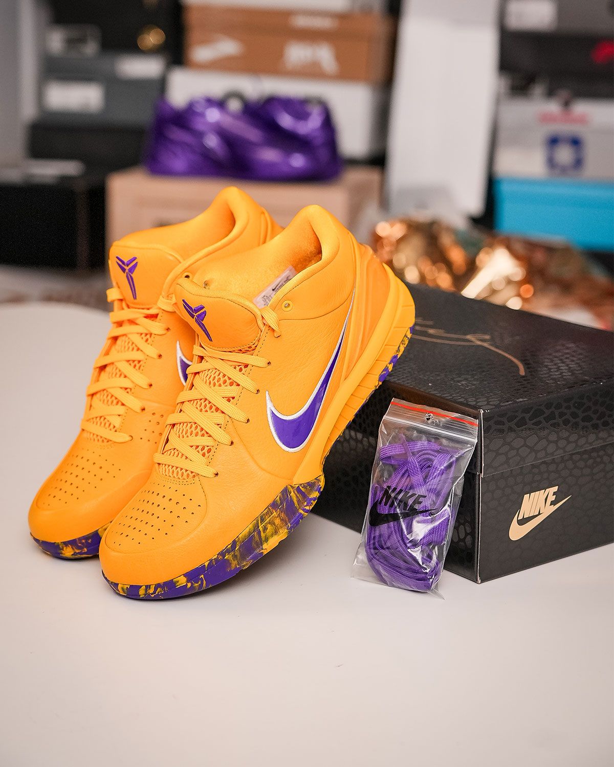 Nike Kobe 4 Protro Lakers colorway in University Gold with marbled yellow and purple outsole, part of the Draft Day blind box collection