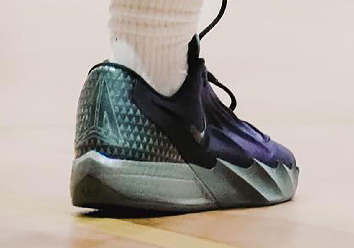 Side profile view of Nike Ja Morant Twelve Time showing wave-sculpted midsole, herringbone traction pattern, and lateral Swoosh branding