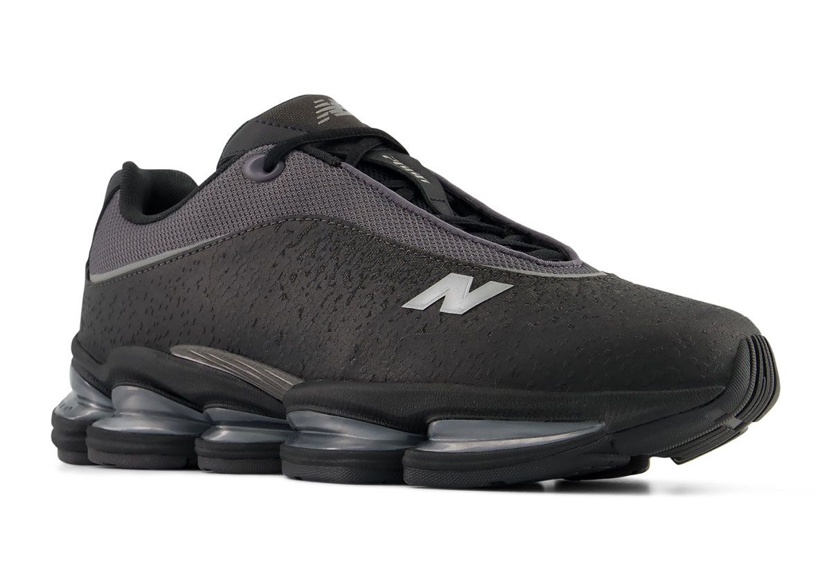 New Balance 2000 Sleek in grey colorway, featuring mesh upper and textured leather lower panel with reflective detailing