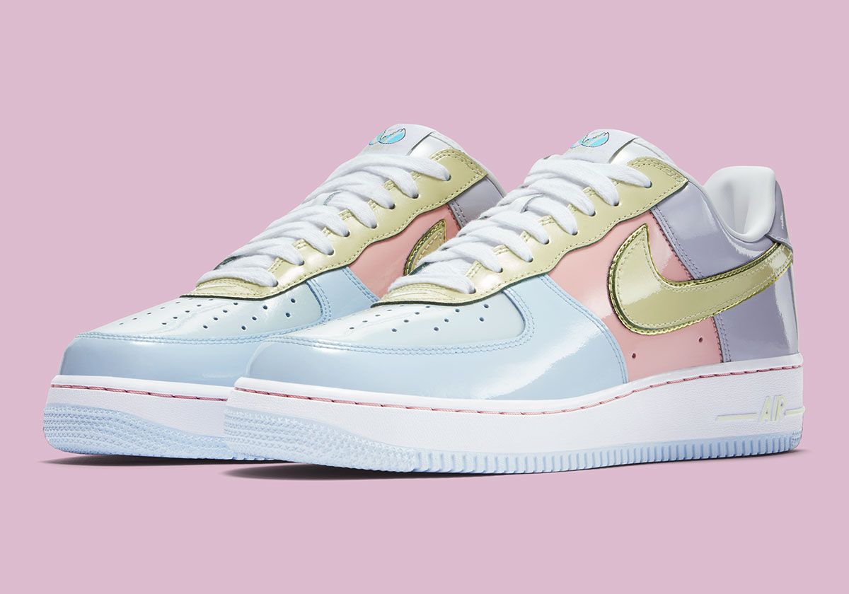 Nike Air Force 1 Low Easter in Titanium blue, Lime Ice green, and Storm Pink patent leather with cracked egg graphic details