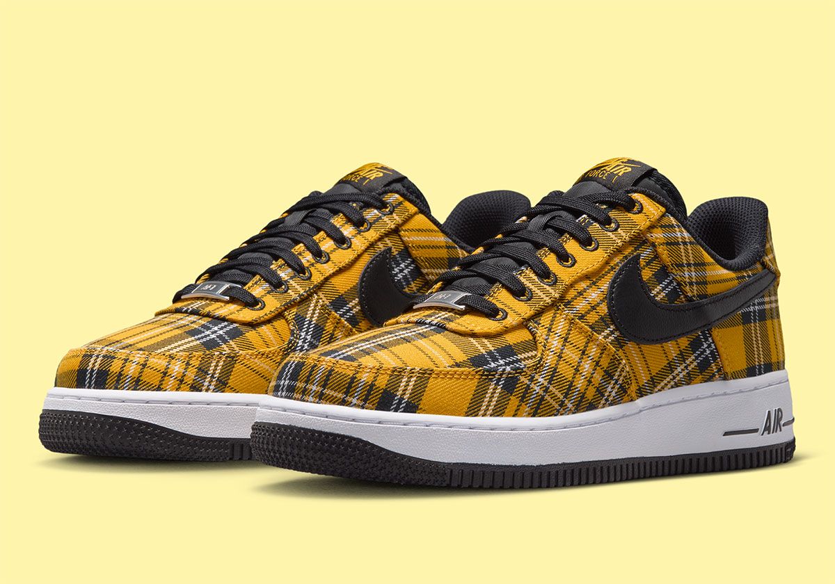 Nike Air Force 1 Low in yellow plaid with white upper and black trim, front three-quarter view