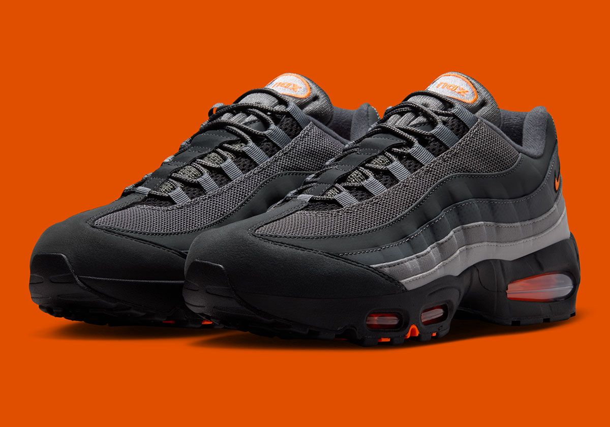 Nike Air Max 95 in Smoke Grey upper with Total Orange Air bubble cushioning and spotted synthetic sidewall detailing
