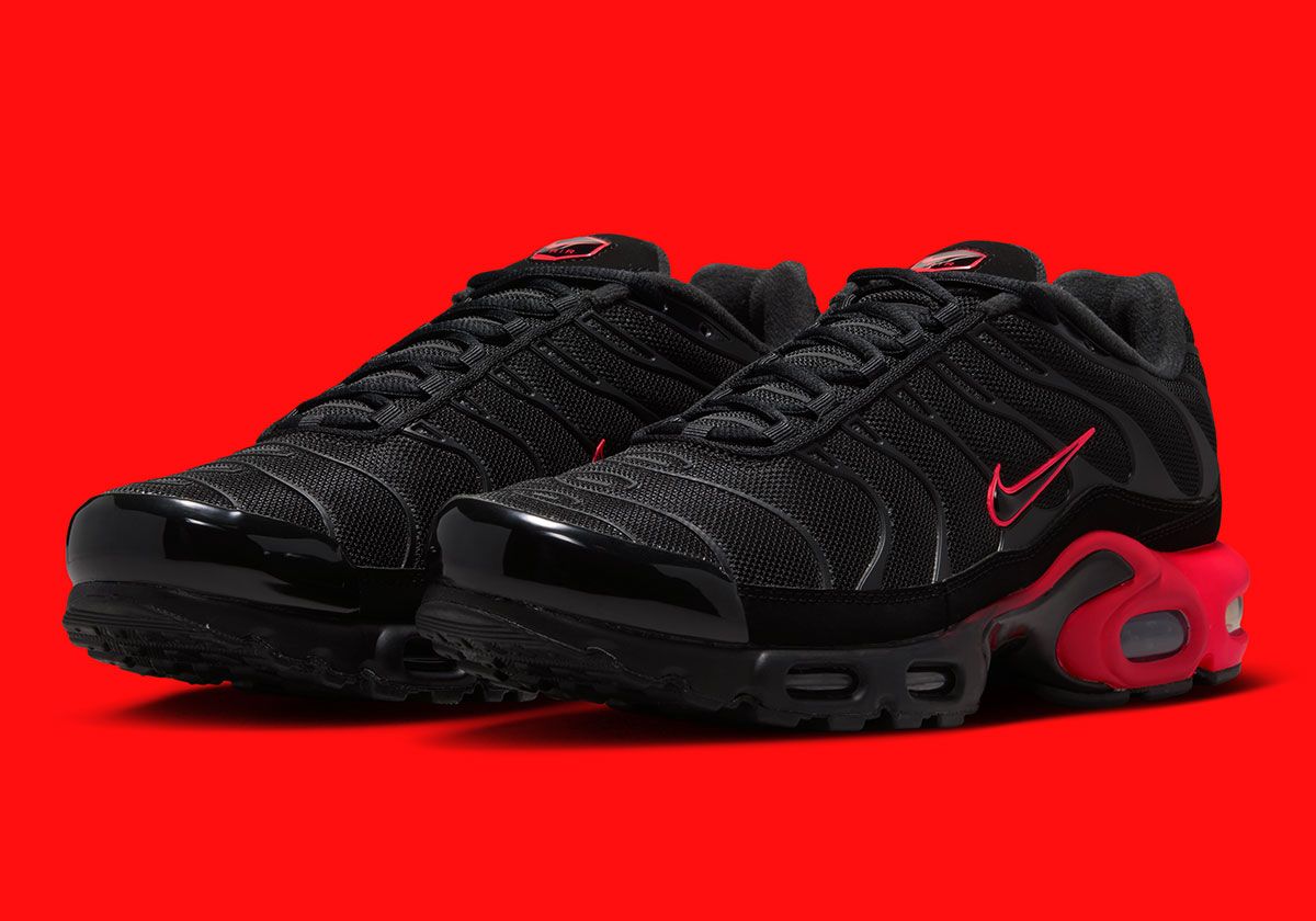 Nike Air Max Plus in Black and Bright Crimson colorway, showcasing split sole unit design and monochromatic upper