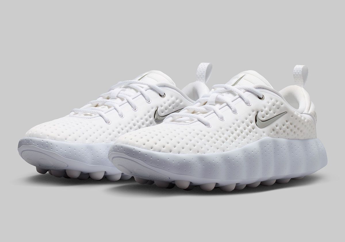 Nike Mind 002 in Vast Grey colorway with white, Anthracite, and Metallic Silver Swoosh