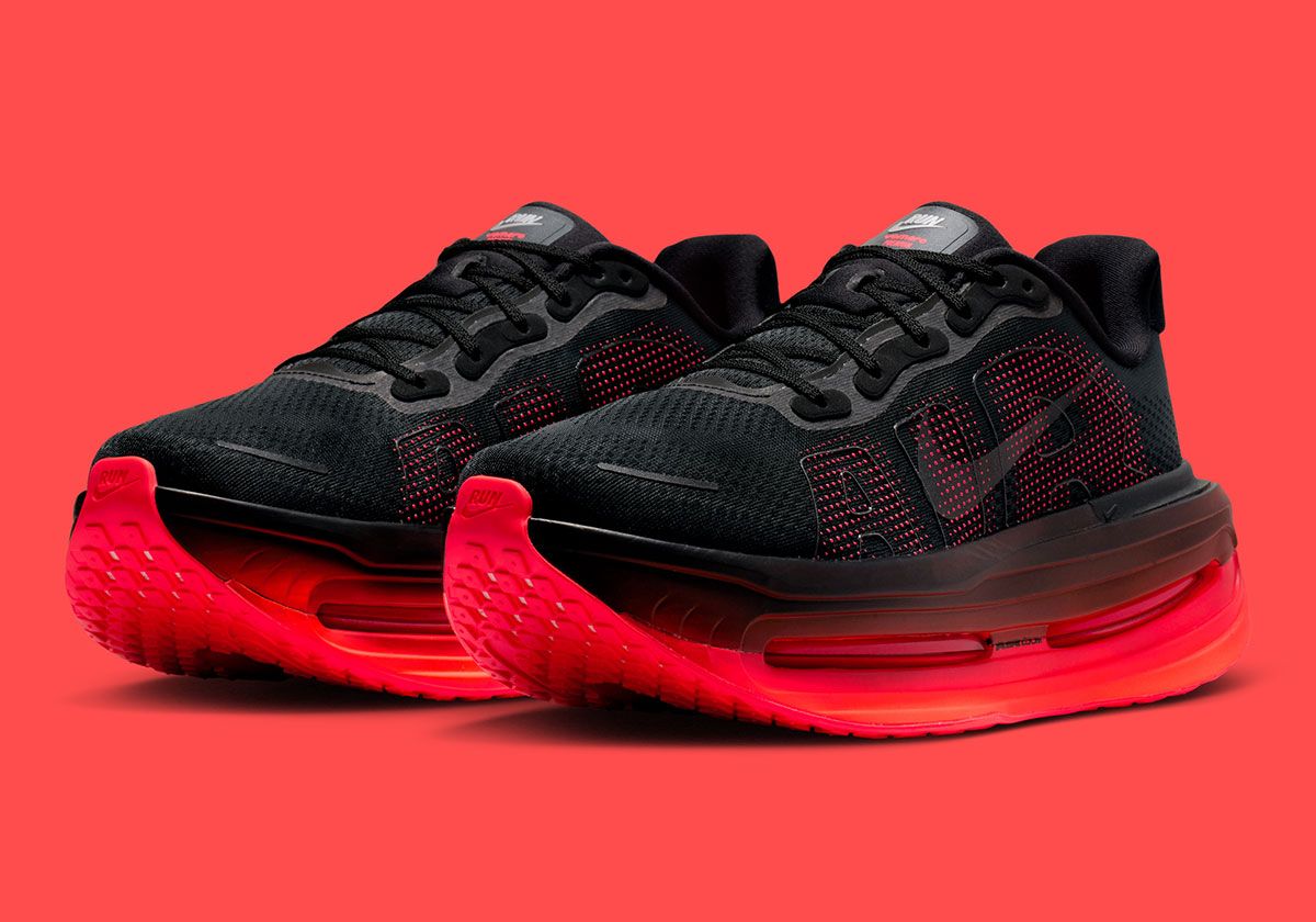 Nike Vomero Premium in Black with Bright Crimson gradient midsole, lateral side view showing AIR text detail