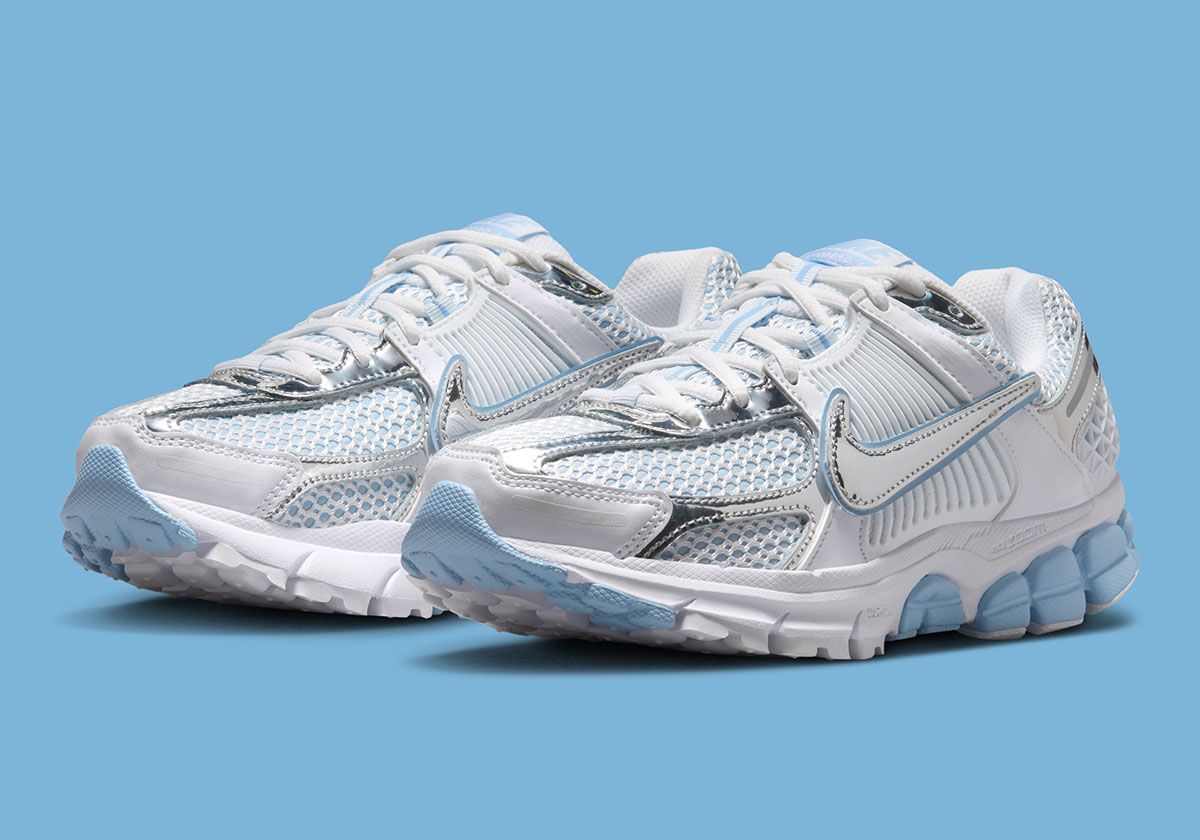 Nike Zoom Vomero 5 Aluminum women's sneaker featuring dual metallic Swooshes and light blue upper